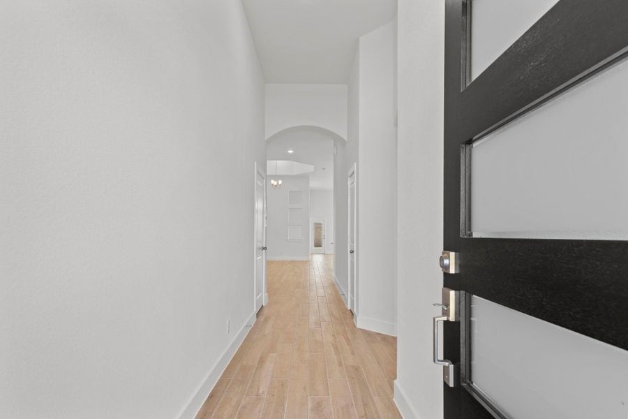 Grand entry with high ceilings and beautiful carefree wood tile flooring!