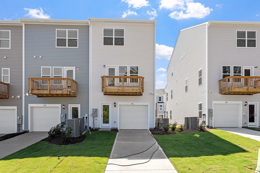 Front exterior of a new home in Renaissance at White Oak, Garner, NC, highlighting curb appeal (Image 20). Front exterior of a new home in Renaissance at White Oak, Garner, NC, highlighting curb appeal (Image 20).
