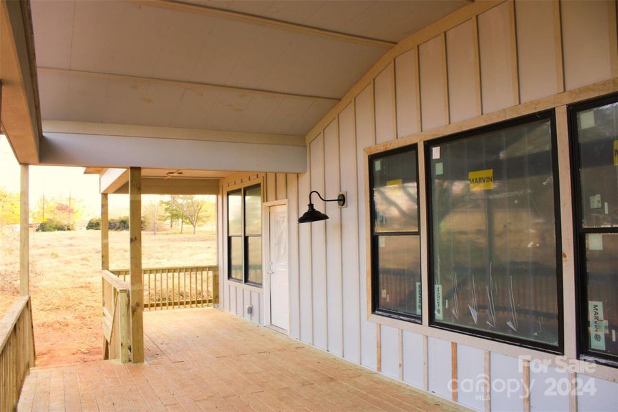 Covered deck with access from the kitchen and primary bedroom.