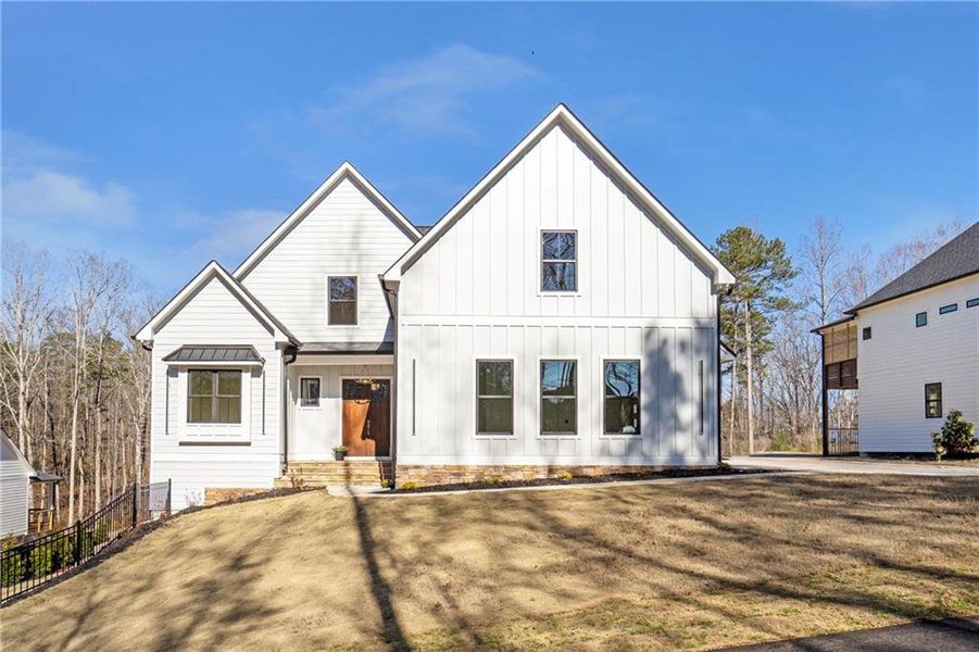 Front exterior of a new home in , Cumming, GA, highlighting curb appeal (Image 1). Front exterior of a new home in , Cumming, GA, highlighting curb appeal (Image 1).