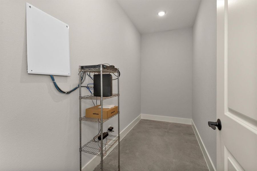 This versatile interior storage room offers a true blank canvas to fit your needs. Whether used to house your central WiFi hub, security system components, safes, seasonal décor, or additional household storage, the space provides flexibility and convenience.Located within the home for easy access, this multi-function room keeps essential systems and valuables organized and secure while maintaining a clean, uncluttered living environment. A practical bonus space ready to adapt to your lifestyle.
