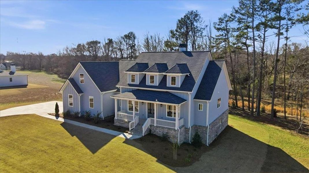 Front exterior of a new home in Old Town Estates, Monroe, GA, highlighting curb appeal (Image 2). Front exterior of a new home in Old Town Estates, Monroe, GA, highlighting curb appeal (Image 2).