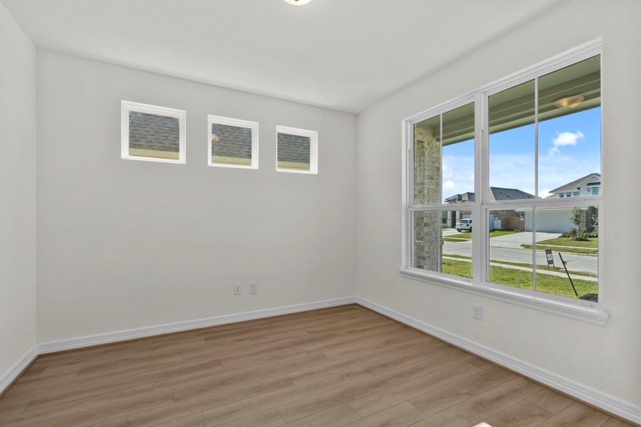 The home office features French doors, beautiful floors, large windows that give a fresh feel, this space promotes focus and creativity.