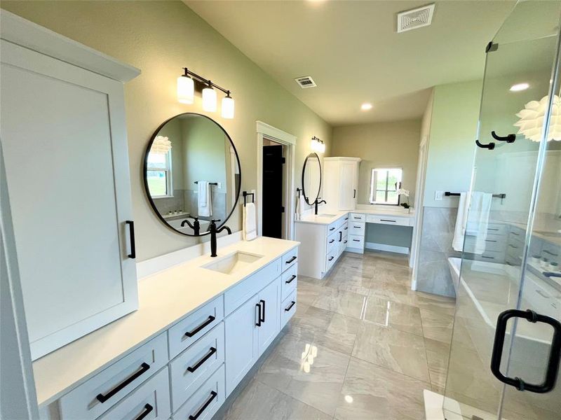 Bathroom with separate shower and tub, tile patterned floors, vanity, and a healthy amount of sunlight