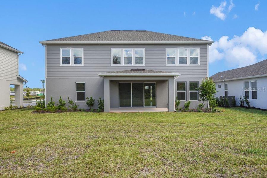 Exterior details and patio area of a home in Ardisia Park, New Smyrna Beach (Image 24).