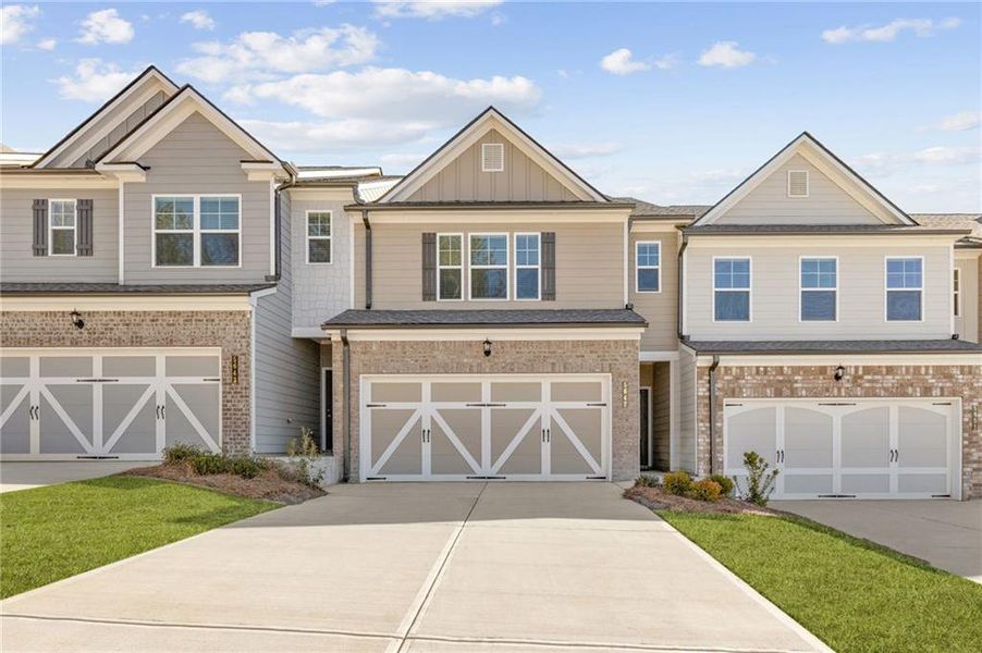 Front exterior of a new home in Mulberry Summit, Flowery Branch, GA, highlighting curb appeal (Image 1). Front exterior of a new home in Mulberry Summit, Flowery Branch, GA, highlighting curb appeal (Image 1).