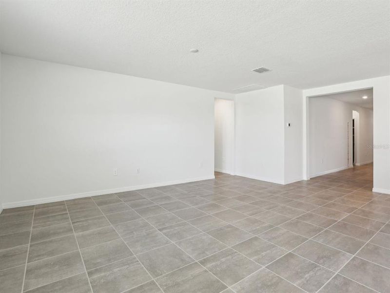 Spacious, unfurnished interior of a new home in The Reserve at Van Oaks, Auburndale (Image 34).