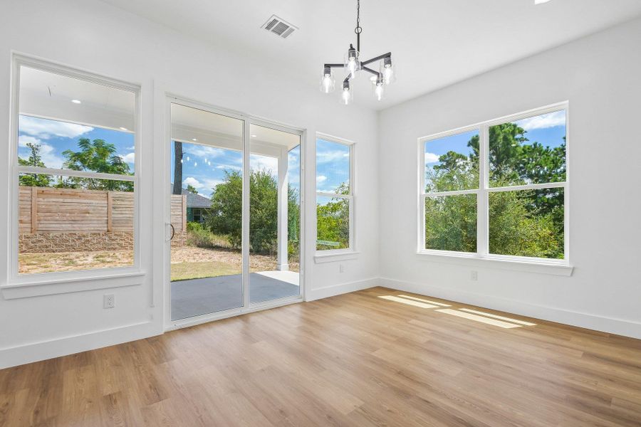 Warm wood flooring and abundant natural light define this versatile dining area. Warm wood flooring and abundant natural light define this versatile dining area.