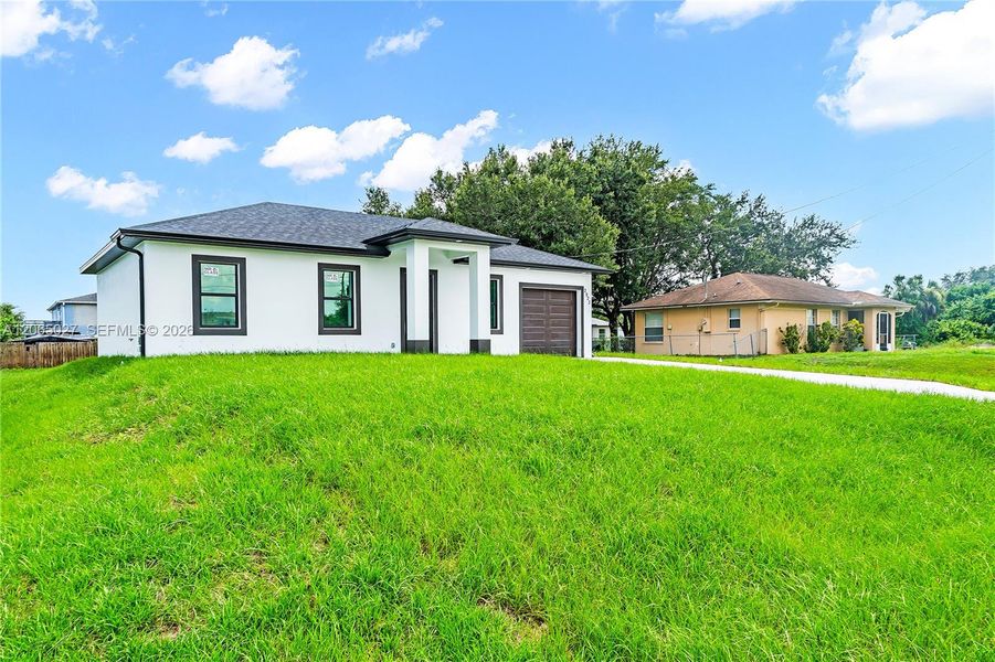 Exterior details and patio area of a home in , Lehigh Acres (Image 27). Exterior details and patio area of a home in , Lehigh Acres (Image 27).