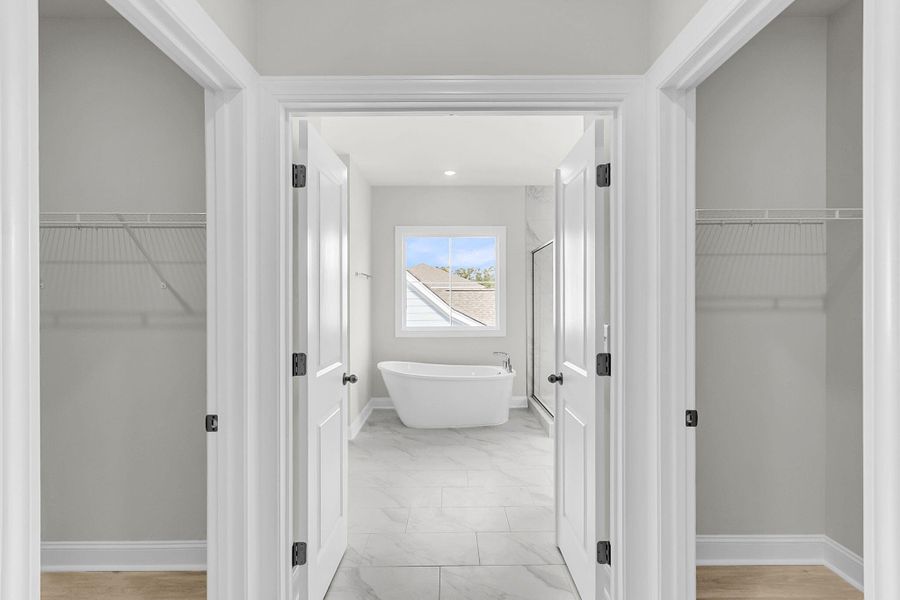 Spacious, unfurnished interior of a new home in Tidewater at Lakes of Cane Bay, Summerville (Image 58).