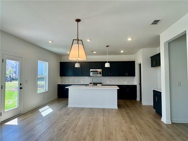 Furnished interior view inside a new home in Eastlyn Crossing, Flowery Branch (Image 7).