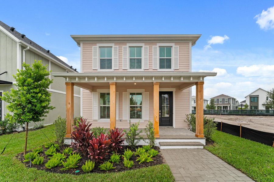 Front exterior of a new home in Newfield - Rosette Park, Palm City, FL, highlighting curb appeal (Image 11). Front exterior of a new home in Newfield - Rosette Park, Palm City, FL, highlighting curb appeal (Image 11).