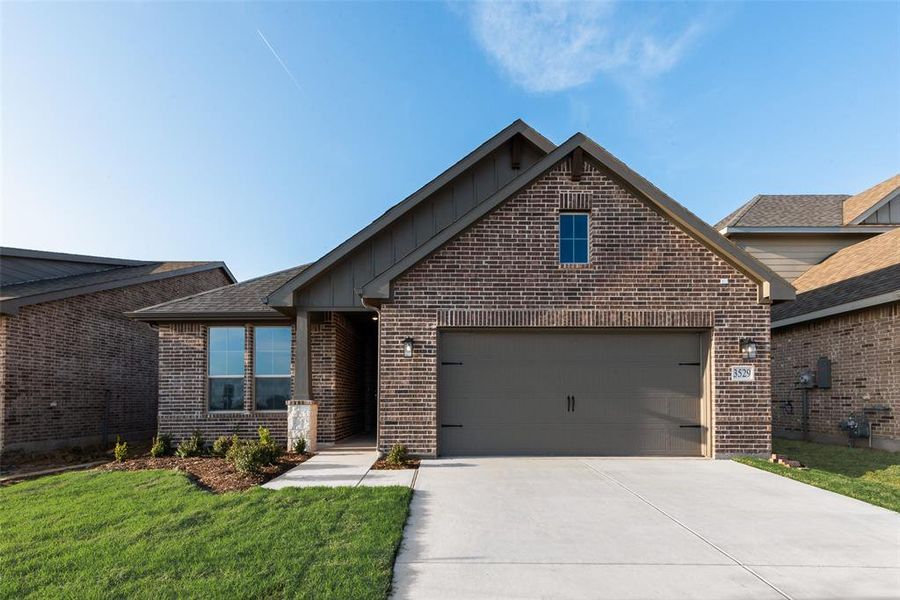Front exterior of a new home in Liberty Pointe, Gainesville, TX, highlighting curb appeal (Image 18). Front exterior of a new home in Liberty Pointe, Gainesville, TX, highlighting curb appeal (Image 18).