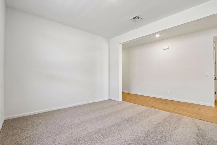 Spacious, unfurnished interior of a new home in Stonebridge Manor, Waddell (Image 11).