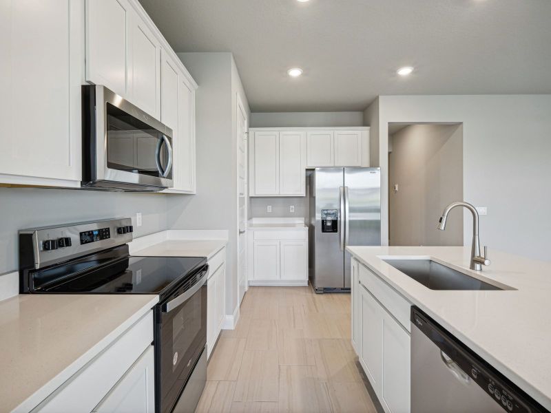 Kitchen in the Bergamo floorplan at 8984 Dahlia Circle