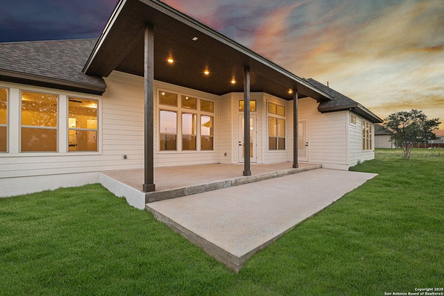 Front exterior of a new home in Potranco Acres, Castroville, TX, highlighting curb appeal (Image 22).