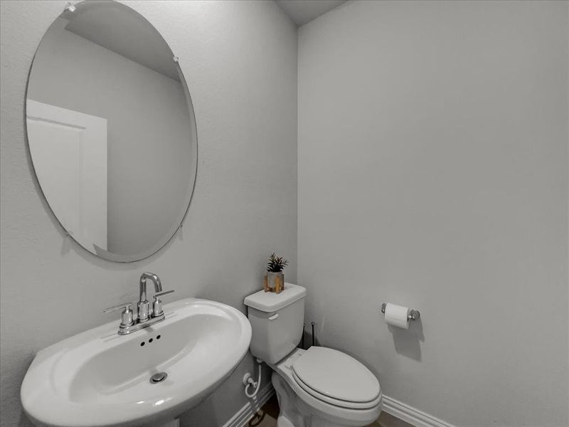 Bathroom featuring sink and toilet