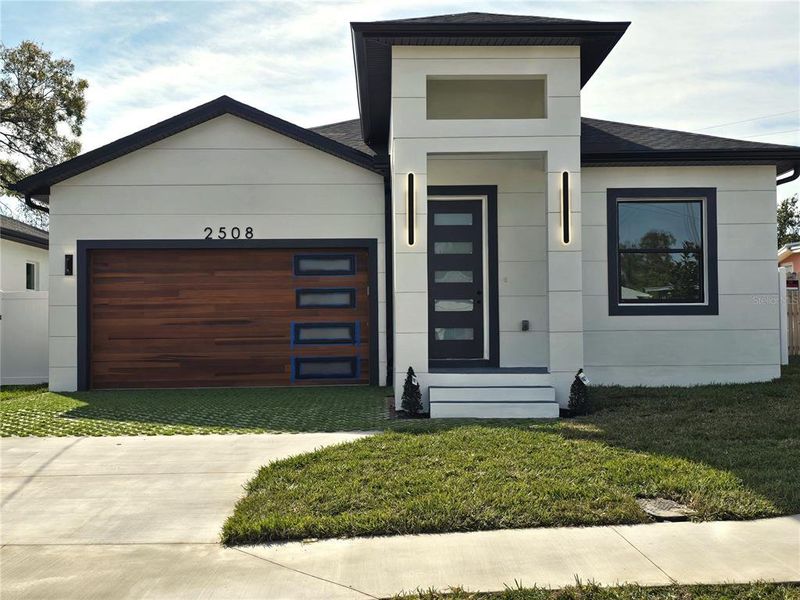 Front exterior of a new home in , Tampa, FL, highlighting curb appeal (Image 25).