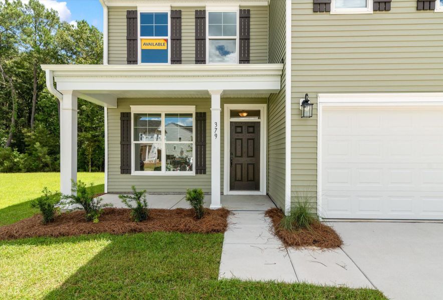 Exterior details and patio area of a home in Oakley Pointe, Moncks Corner (Image 2). Exterior details and patio area of a home in Oakley Pointe, Moncks Corner (Image 2).