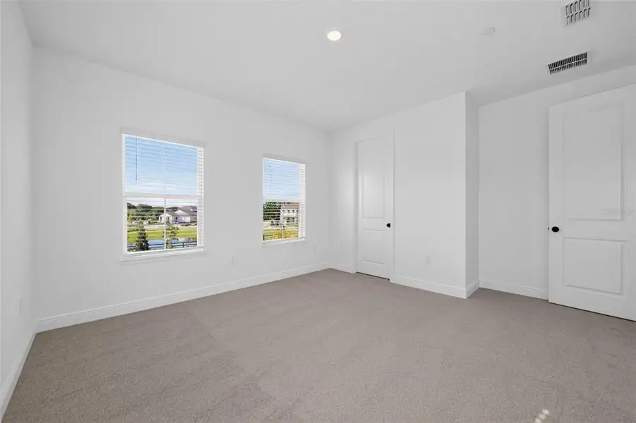 Spacious, unfurnished interior of a new home in Lake Cawood Cove, Windermere (Image 18).