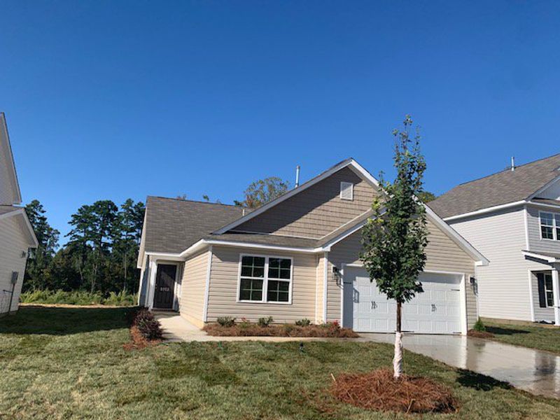 Front exterior of a new home in Avondale, Greensboro, NC, highlighting curb appeal (Image 1). Front exterior of a new home in Avondale, Greensboro, NC, highlighting curb appeal (Image 1).