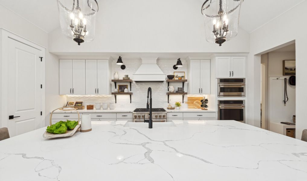 Kitchen with floating shelves and quartz countertops Kitchen with floating shelves and quartz countertops