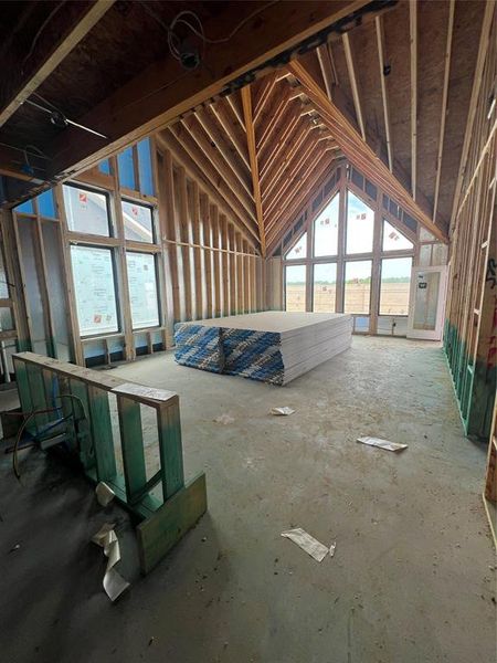 Vaulted windows peak to meet high ceilings with incredible amounts of natural lighting. This floor plan always feels much larger than it is. Swipe over to see a representation of this space once completed.