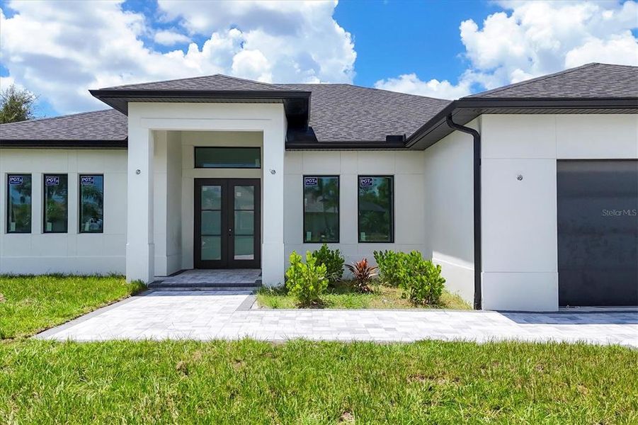 Front exterior of a new home in , Rotonda West, FL, highlighting curb appeal (Image 23).