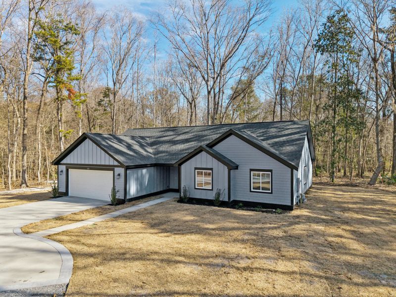 Front exterior of a new home in , Moncks Corner, SC, highlighting curb appeal (Image 1). Front exterior of a new home in , Moncks Corner, SC, highlighting curb appeal (Image 1).