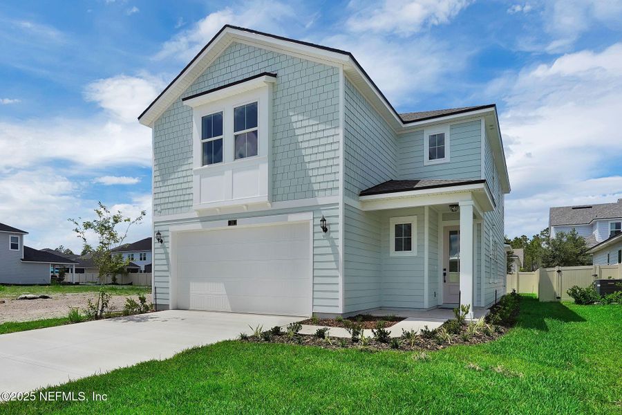 Front exterior of a new home in Seabrook Village at Nocatee, Ponte Vedra, FL, highlighting curb appeal (Image 1).