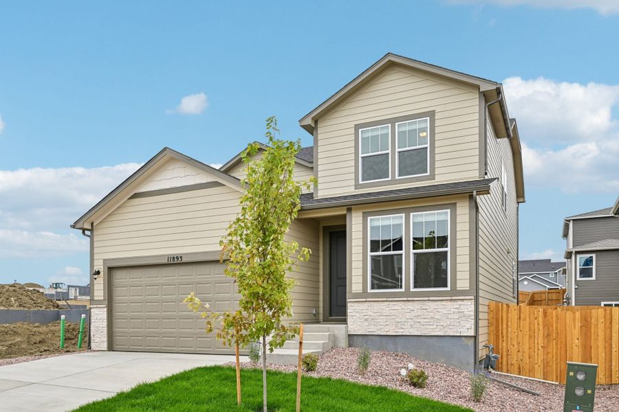 Front exterior of a new home in Ridge at Lorson Ranch, Colorado Springs, CO, highlighting curb appeal (Image 21). Front exterior of a new home in Ridge at Lorson Ranch, Colorado Springs, CO, highlighting curb appeal (Image 21).