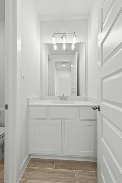 Furnished interior view inside a new home in Sunterra, Katy (Image 6).