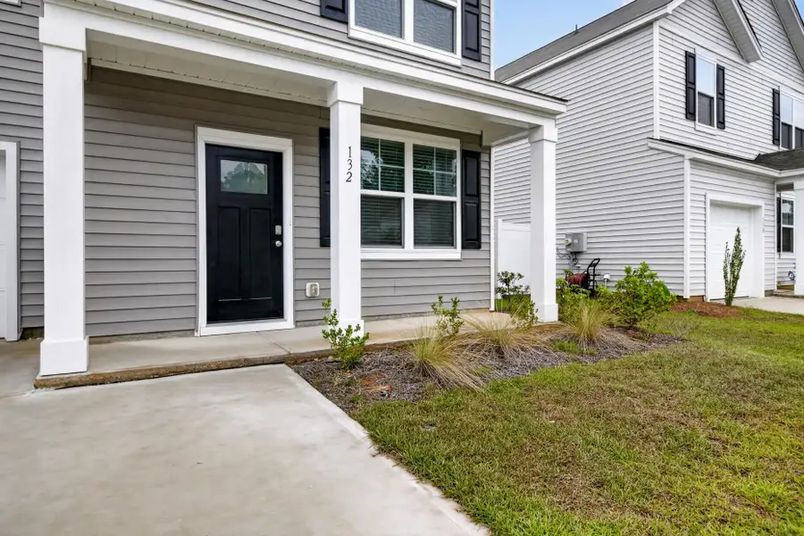 Exterior details and patio area of a home in Back River Bend, Goose Creek (Image 17).