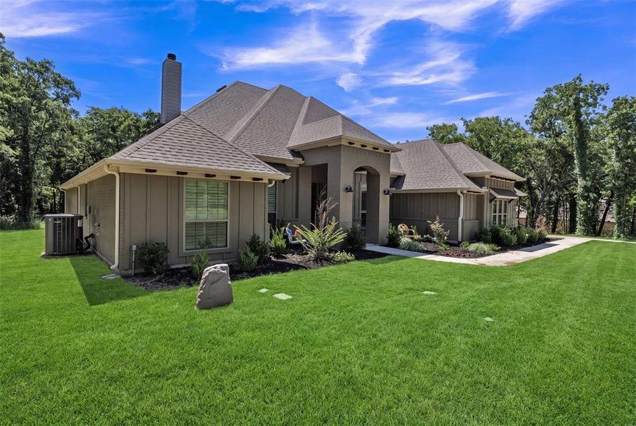 Front exterior of a new home in , Poolville, TX, highlighting curb appeal (Image 23). Front exterior of a new home in , Poolville, TX, highlighting curb appeal (Image 23).