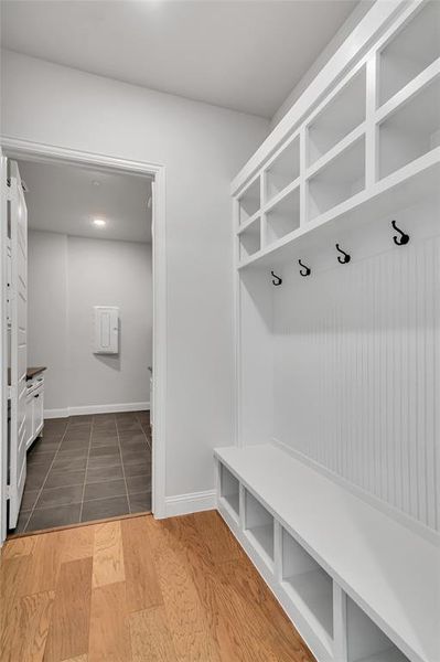 Mudroom with dark hardwood / wood-style flooring