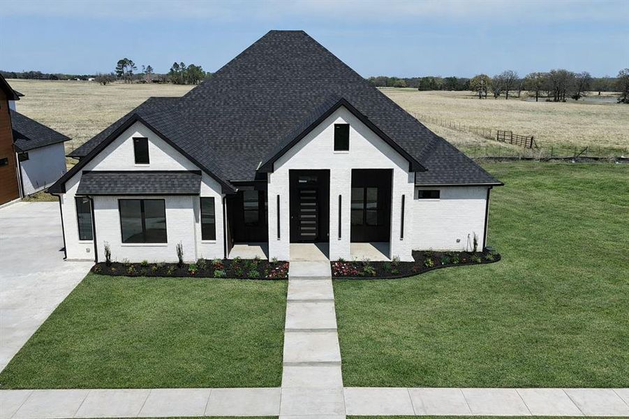 Front exterior of a new home in , Pottsboro, TX, highlighting curb appeal (Image 29).