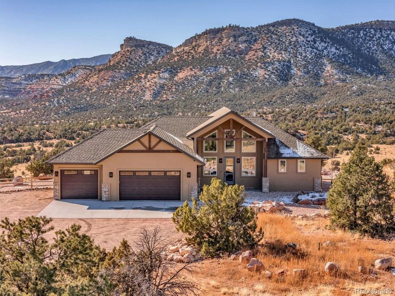 Front exterior of a new home in , Cañon City, CO, highlighting curb appeal (Image 1). Front exterior of a new home in , Cañon City, CO, highlighting curb appeal (Image 1).