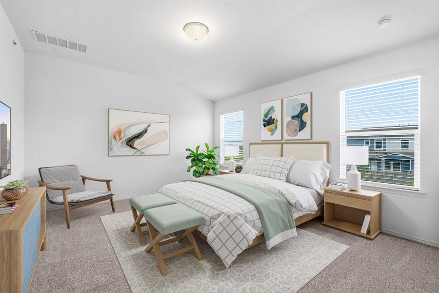 Carpeted bedroom featuring white walls and a ceiling-mounted light fixture