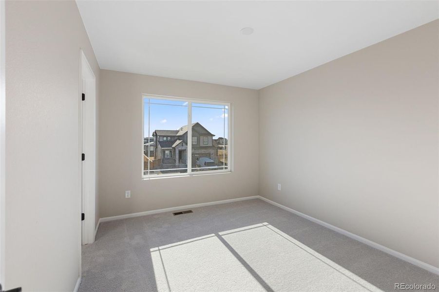 Spacious, unfurnished interior of a new home in The Cottages Collection at Ridgeline Vista, Brighton (Image 19).