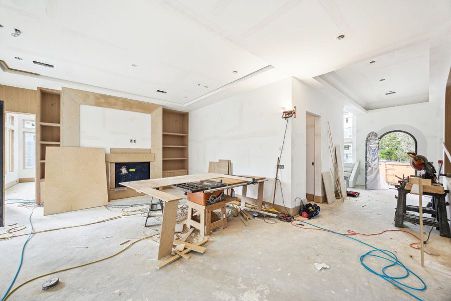 Family Room with a 42 Inch Direct Vent Fireplace and built-ins on each side of the fireplace.