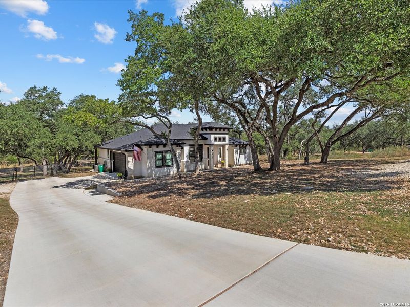 Front exterior of a new home in , New Braunfels, TX, highlighting curb appeal (Image 1). Front exterior of a new home in , New Braunfels, TX, highlighting curb appeal (Image 1).