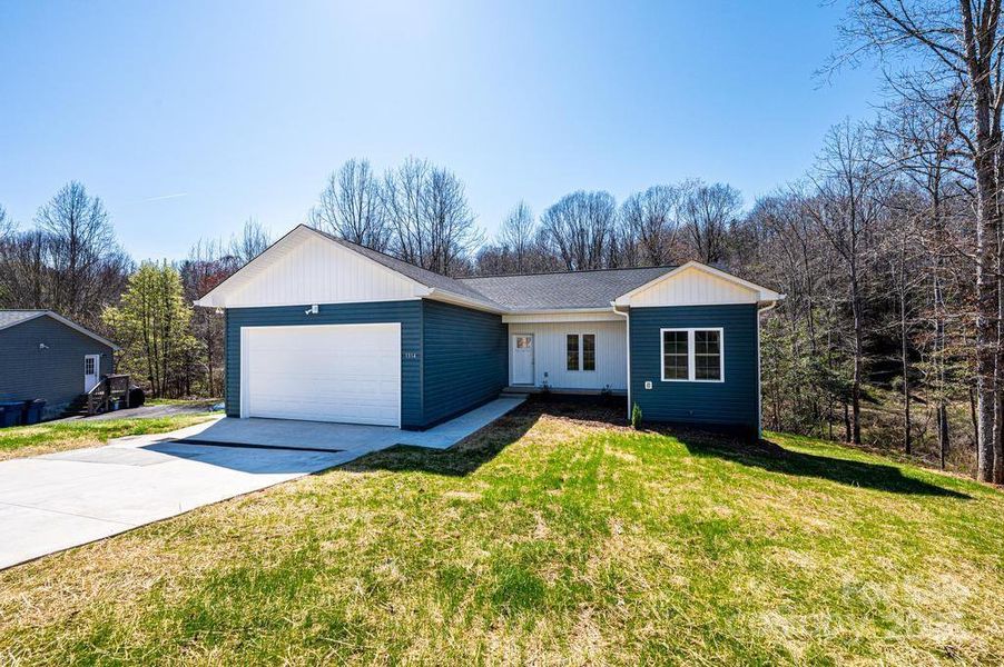 Front exterior of a new home in , Hickory, NC, highlighting curb appeal (Image 15).