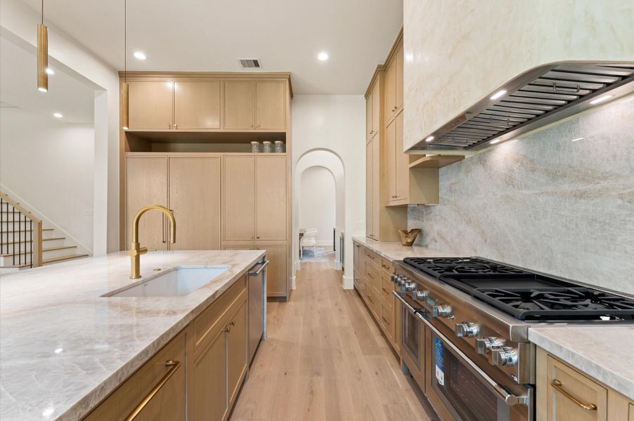 Kitchen. *Previous project by the same developer, floor plans and selections may vary.*