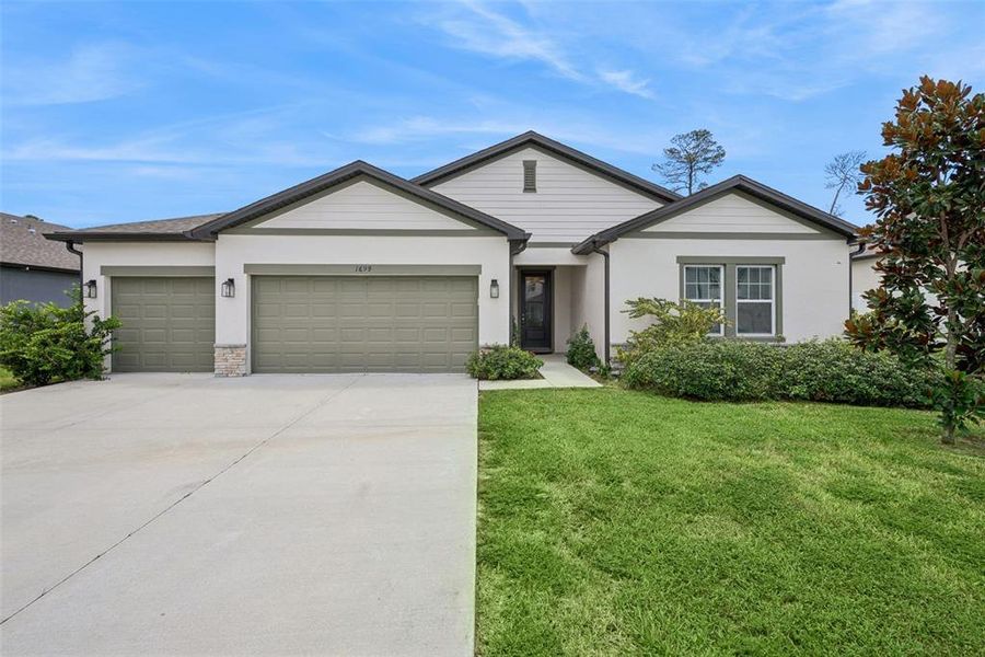 Front exterior of a new home in , Deltona, FL, highlighting curb appeal (Image 24).