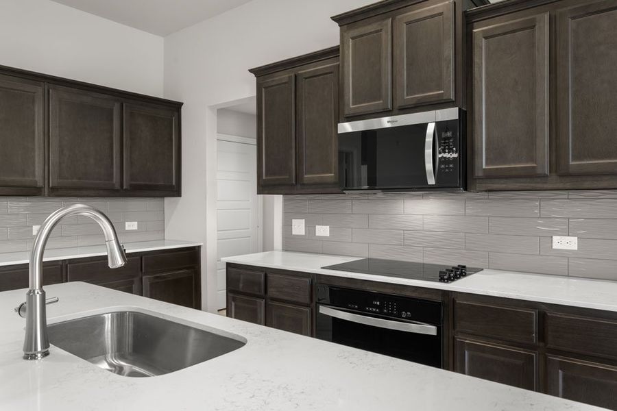 Front exterior of a new home in Still Water Lake, Godley, TX, highlighting curb appeal (Image 16). Front exterior of a new home in Still Water Lake, Godley, TX, highlighting curb appeal (Image 16).