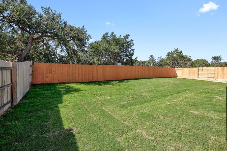 Exterior details and patio area of a home in Lariat, Liberty Hill (Image 15).