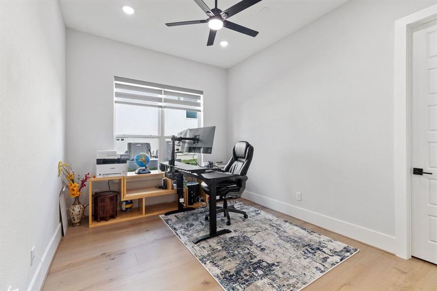 Home office with wood finished floors, a ceiling fan, and recessed lighting