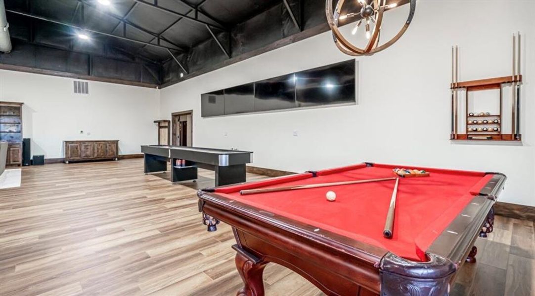 Rec room featuring billiards and a high ceiling Rec room featuring billiards and a high ceiling