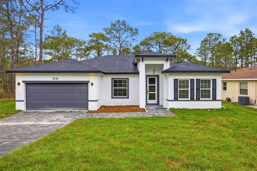 Front exterior of a new home in , Citrus Springs, FL, highlighting curb appeal (Image 17).