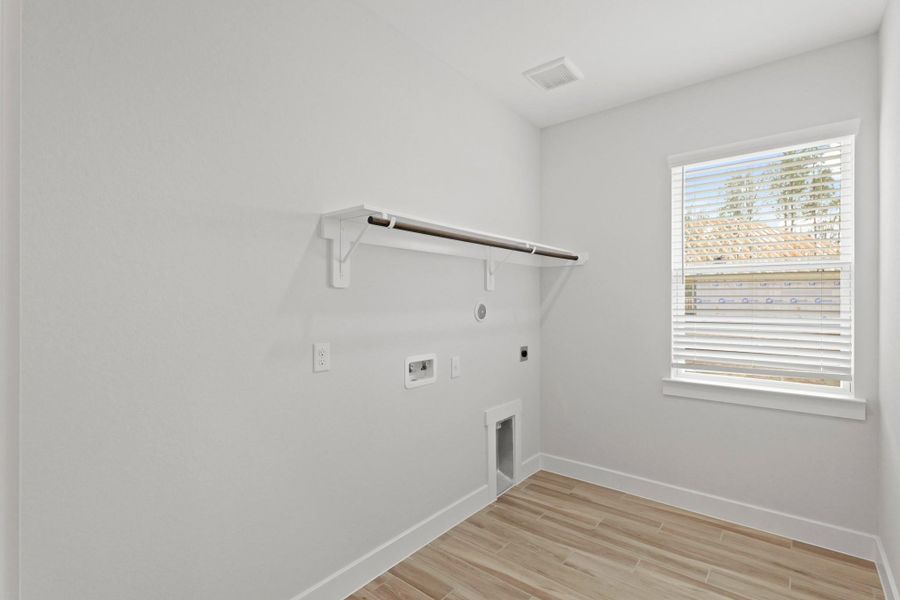 Laundry room (*Photo not of actual home and used for illustration purposes only.)